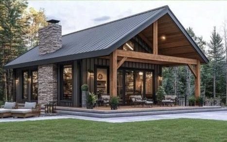 A cabin with a stone chimney, exposed timber beams and a covered outdoor room